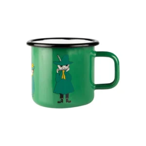 The Snufkin - Moomin green enamel mug 3.7dl has a black rim and features Snufkin in a green coat and hat playing harmonica, with other characters partly visible—a charming Estonian design, ideal for gift shops. Gate21.ee