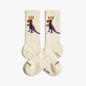 Cream-coloured Basquiat Pez Dispenser - Athletic socks with a cartoon dinosaur wearing a yellow crown and “JAM” and “JASON” near the toes—an eye-catching pick for Tallinn shopping or your favourite curated gift shop. Gate21.ee