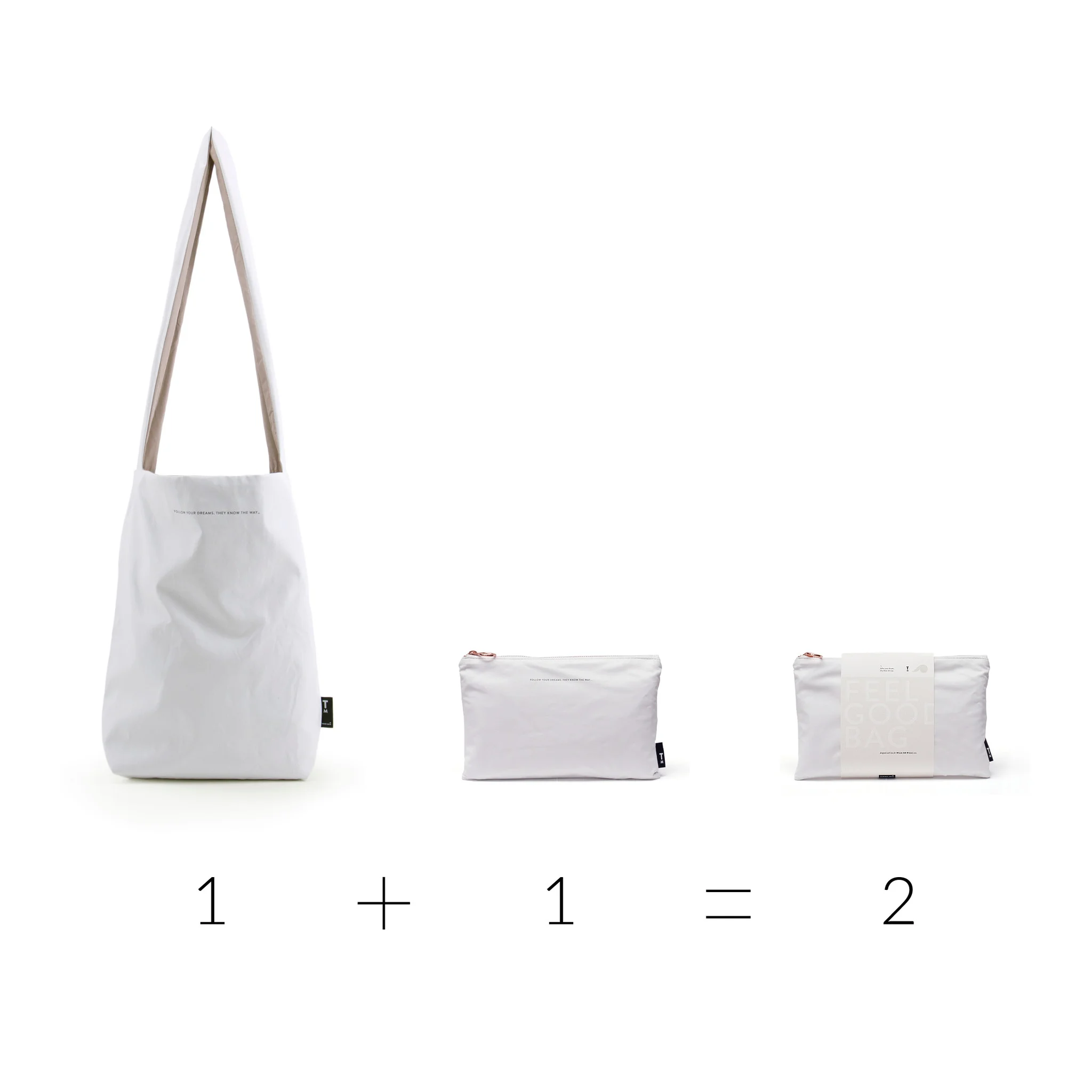 The Feel Good Bag – Dusty Gold is displayed alongside a white tote and zippered pouch, with "1 + 1 = 2" beneath—perfectly curated for those who love unique ideas from your favourite concept store. Gate21.ee