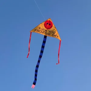 FUCK YOU FROM THE SKY - Kite: This bold yellow triangle kite features a red smiley face, playful message, striped tail, and red ribbons. Show off Estonian design with this quirky find for Tallinn shopping or any unique gift shop. Gate21.ee