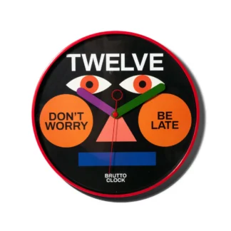The BE LATE - Wall clock boasts a bold red rim and black face, Estonian-designed with geometric shapes and quirky text accents including TWELVE at the top&mdash;an eye-catching piece ideal for any modern concept shop. Gate21.ee