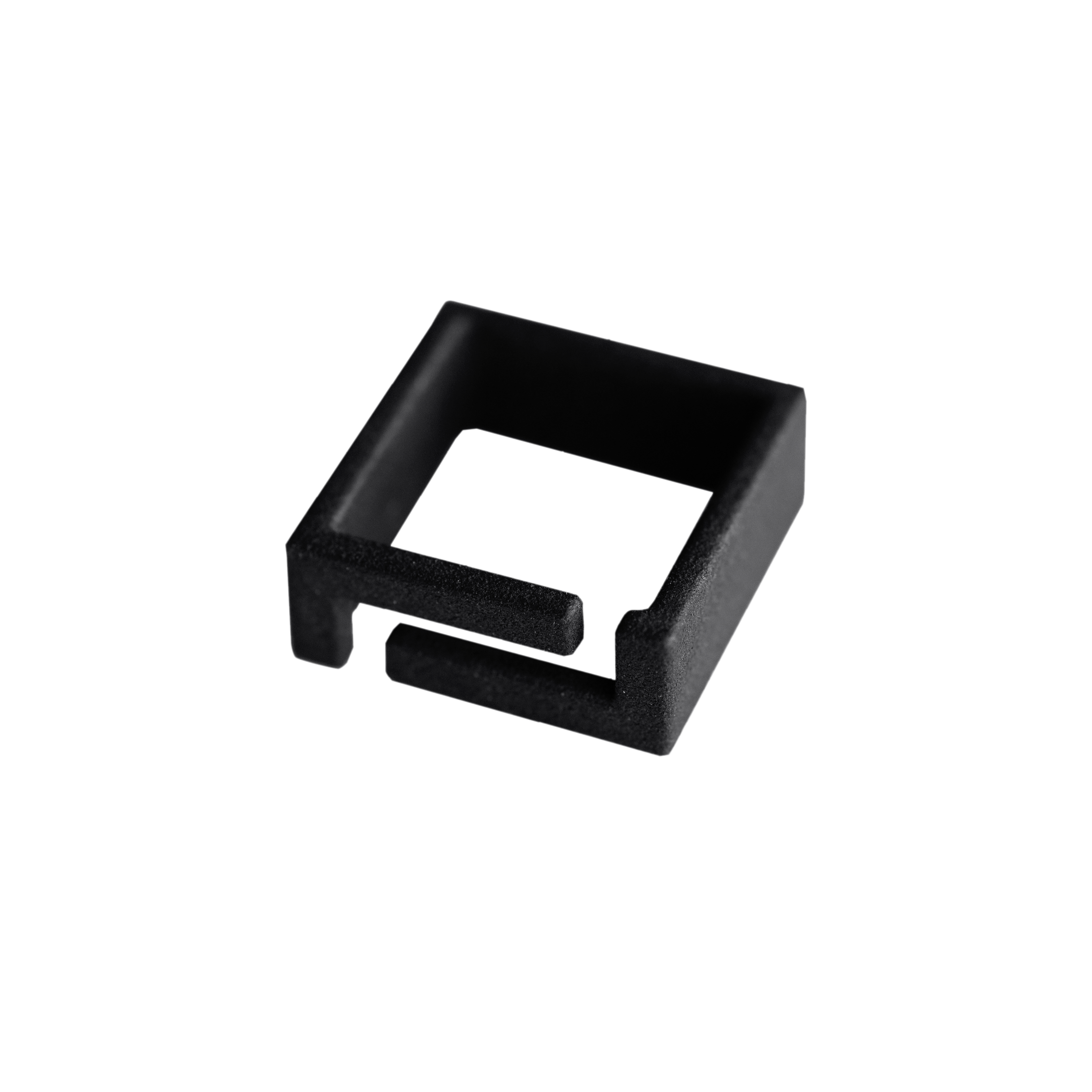 A black, square-shaped plastic or metal bracket with an open end and a cut-out section on one side, showcased on a plain white background—perfect for any curated concept shop with a focus on Estonian design. Gate21.ee