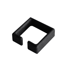 A black, square-shaped plastic clip with one open side, photographed on a plain white background—an example of curated Estonian design. Gate21.ee