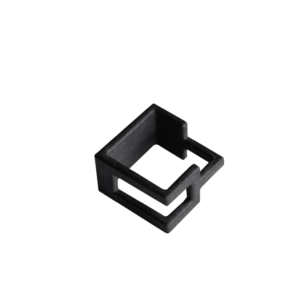 A black, rectangular, open-frame plastic or metal clip with geometric cut-outs&mdash;showcasing Estonian design&mdash;is displayed against a plain white background. Gate21.ee