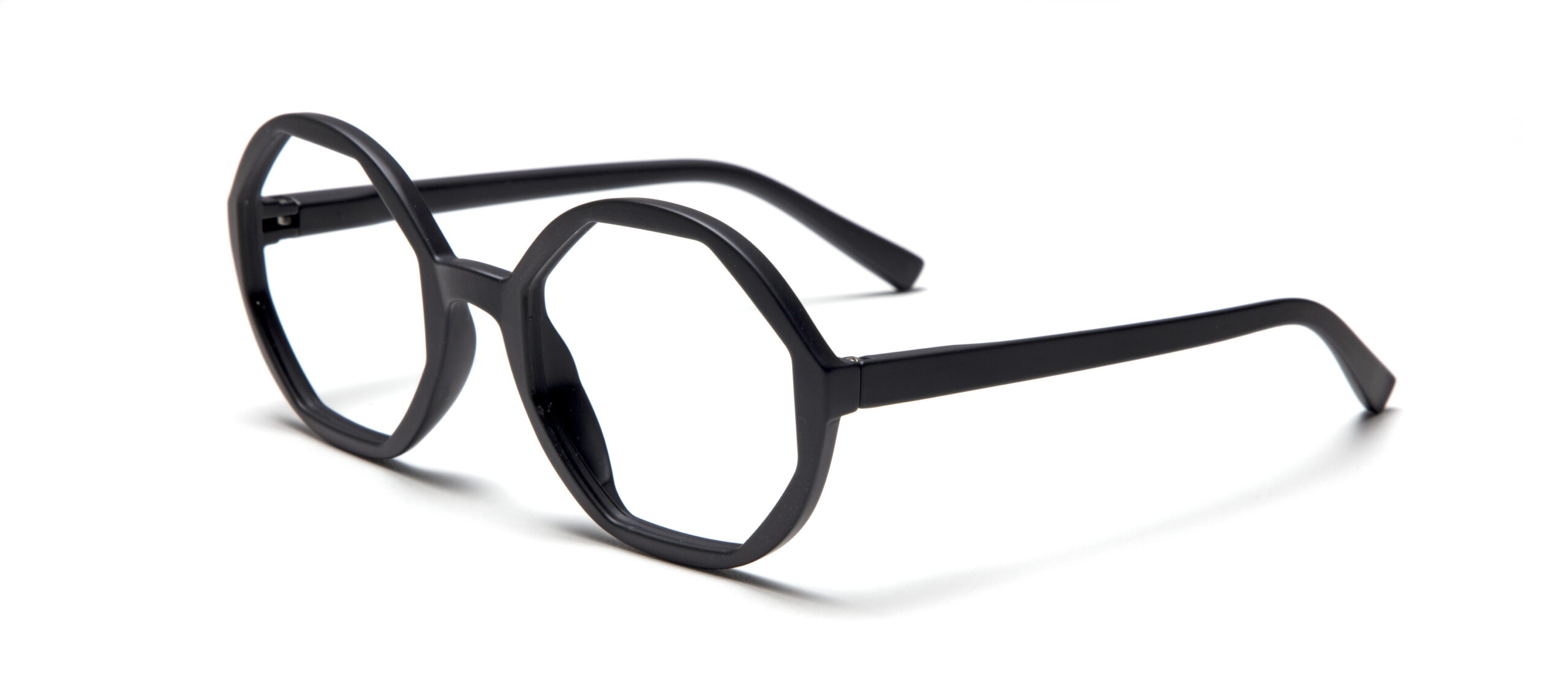 The LOLITA - Black eyeglasses feature octagonal frames and clear lenses, inspired by Estonian design, shown on a white background. Gate21.ee
