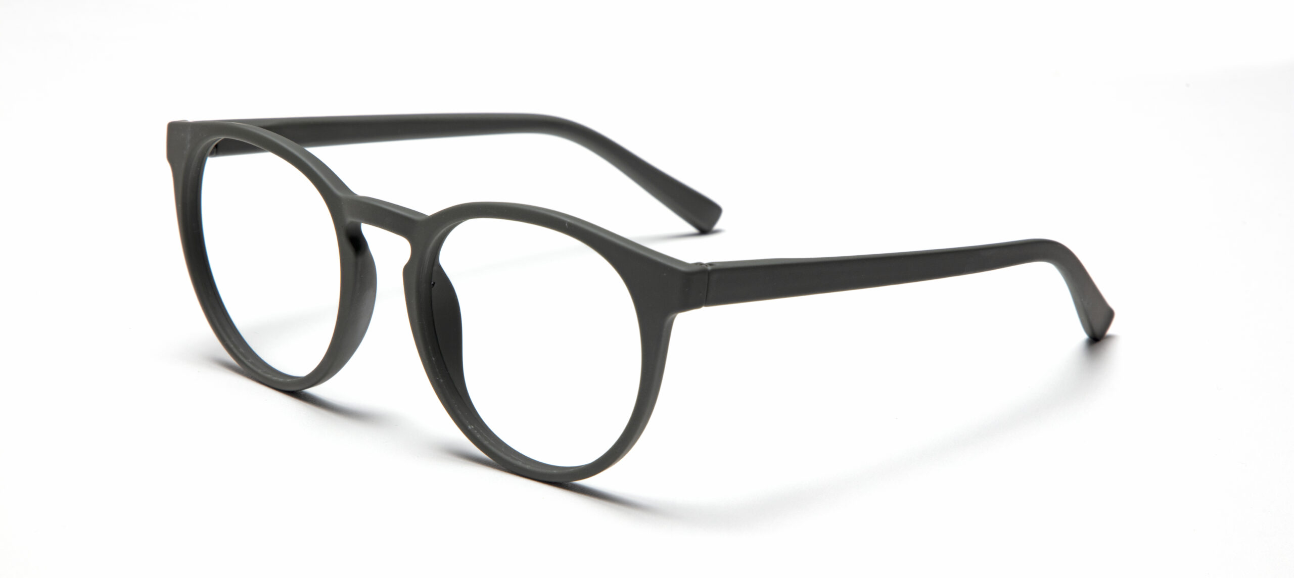 A pair of PAPILLON - Olive Green round spectacles with clear lenses, shown at an angle on a white background—showcasing distinctive Estonian-inspired design. Gate21.ee