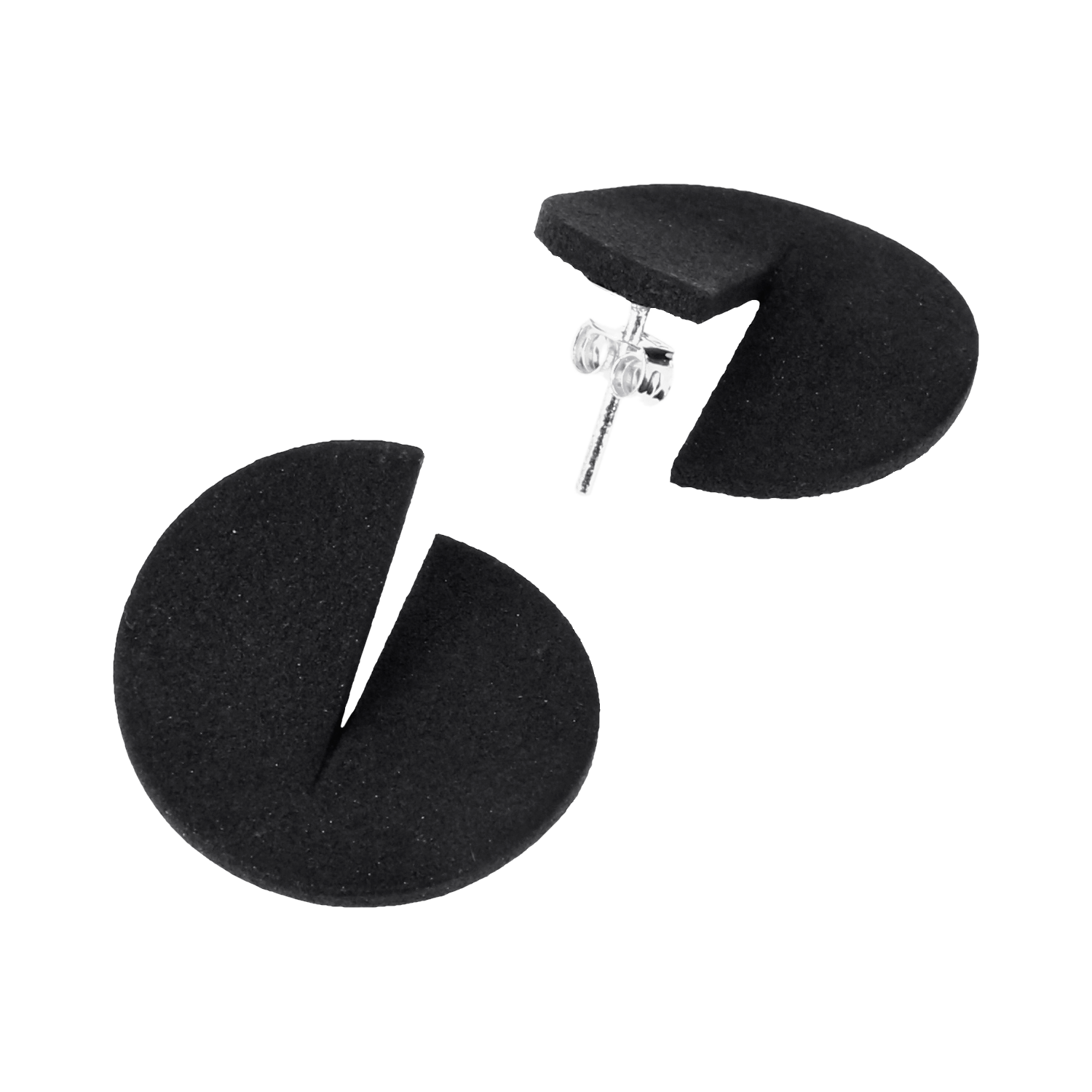 A pair of round, matte black stud earrings with a wedge-shaped cut-out, resembling a Pac-Man shape, displayed on a plain white background—perfect for adding unique style to your Tallinn shopping finds or as a chic gift shop treasure. Gate21.ee