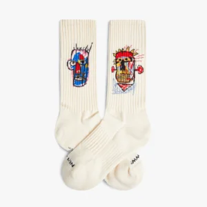 The Basquiat Heads 1982 - Athletic socks are off-white, ribbed, and feature bold, abstract face designs inspired by expressive art—a standout find for your Tallinn shopping adventure or a unique gift shop choice. Gate21.ee
