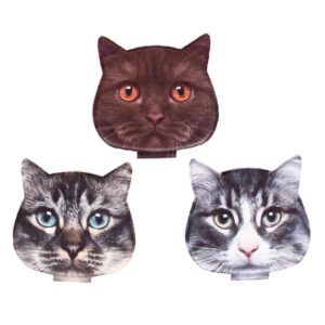 The Travel mirror - Cats features three cat head-shaped designs on a white background: a dark brown cat with orange eyes, a grey tabby with blue eyes, and a grey-and-white tabby with green eyes. Gate21.ee
