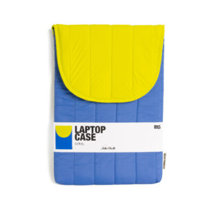 The Puffy laptop sleeve 15''- Blue, featuring a vibrant blue and yellow padded design with a flap fastening, is displayed in its packaging. Ideal for gift shops, the label highlights essential product details and eye-catching style. Gate21.ee