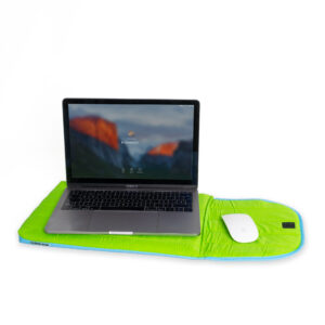 The Puffy laptop sleeve 15´´- Green, with blue trim and inspired by Estonian design, holds a laptop and wireless mouse, making an eye-catching statement against a plain white background. Gate21.ee