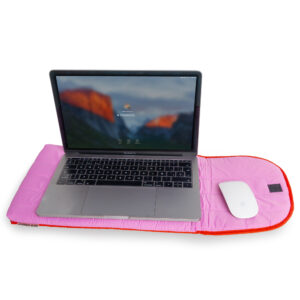 A Puffy laptop sleeve 15''- Pink is placed beneath a laptop and wireless mouse against a white background, offering a stylish and standout display idea for any concept shop. Gate21.ee