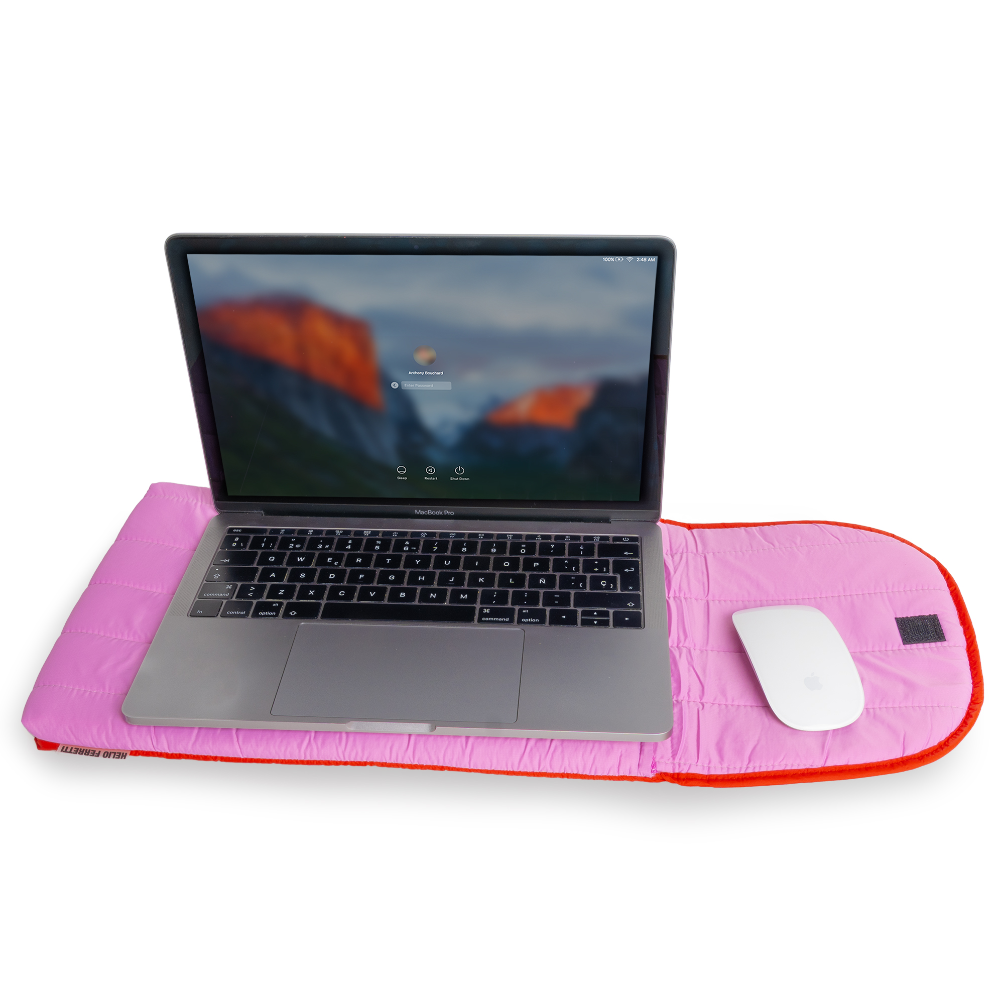 A Puffy laptop sleeve 15''- Pink is placed beneath a laptop and wireless mouse against a white background, offering a stylish and standout display idea for any concept shop. Gate21.ee