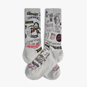 A pair of Goonies 4 Life - Athletic grey socks with black, red, and yellow cartoon designs—an ideal quirky find from a Tallinn shopping trip or a playful addition to an Estonian design-inspired gift shop. Gate21.ee