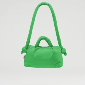The Mini Ona Soft Bag - Green is a padded handbag with one short and one long handle, displayed against a white background. Curated for modern shoppers, this chic accessory stands out in Tallinn shopping and concept store collections. Gate21.ee