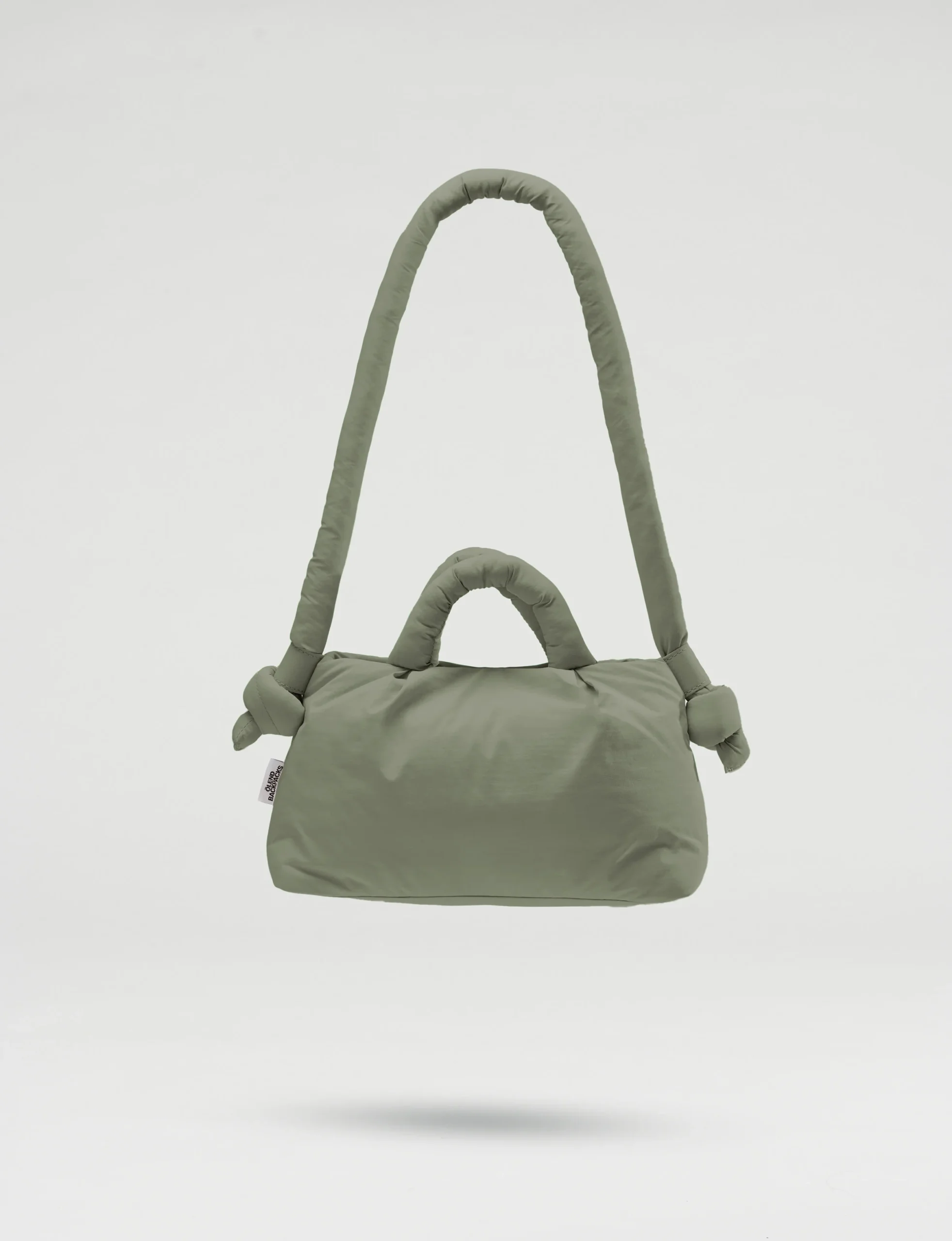 The Mini Ona Soft Bag - Sage is a soft, padded olive green handbag with short and long handles, featuring knotted details near the long strap. Shown against a plain white background, it's perfect for shopping in Tallinn. Gate21.ee