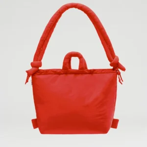 The Ona Soft Bag - Red is a bright, padded tote showcasing Estonian design, with a large rounded handle, two side knots, and a small central handle—curated and photographed against a plain white background. Gate21.ee