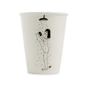 The Yoga in the Shower Cup is a white mug featuring a black line drawing of a person doing yoga under a shower with mobiles, showcasing curated Estonian design&mdash;perfect for any gift shop. Gate21.ee