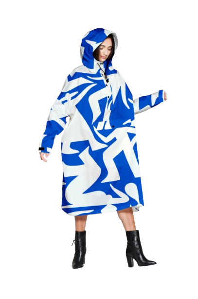 Wearing Timo - Blue, an oversized hooded poncho with bold blue and white patterns, paired with black heeled ankle boots—ideal for shopping in Tallinn or exploring concept shops. Gate21.ee