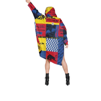 A person wearing the Box Box - Special Edition, a colourful oversized hoodie with red, yellow, blue, and black blocks, stands with one arm raised&mdash;an ideal pick for those exploring unique Tallinn shopping or fresh concept shop trends. Gate21.ee