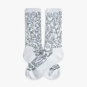 Keith Haring Community - Athletic: White crew socks with black line art of abstract dancing figures in Keith Haring's iconic style. Small printed text on the toes. Ideal for Tallinn shopping trips or anyone seeking unique fashion ideas. Gate21.ee