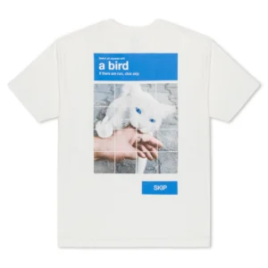 A Bird Tee - Bone: A playful white T-shirt with a CAPTCHA-style grid showing a white cat biting a hand, labelled "Select all squares with a bird" and blue SKIP button—a fun Estonian design for Tallinn shopping or unique gift shop finds. Gate21.ee