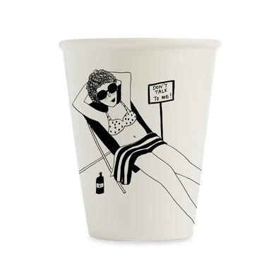 The Don’t talk to me Mug is a white mug with a black line drawing of a woman in sunglasses and a spotty bikini lounging by her drink, next to the phrase “DON’T TALK TO ME!”—perfect for fans of quirky, unique concepts. Gate21.ee