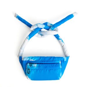 The Knotflex Pack - Sky features a blue and white cloud pattern, displayed against a white background. Its thick strap is tied in an overhand knot, making this stylish accessory ideal for trendsetters and concept shops alike. Gate21.ee