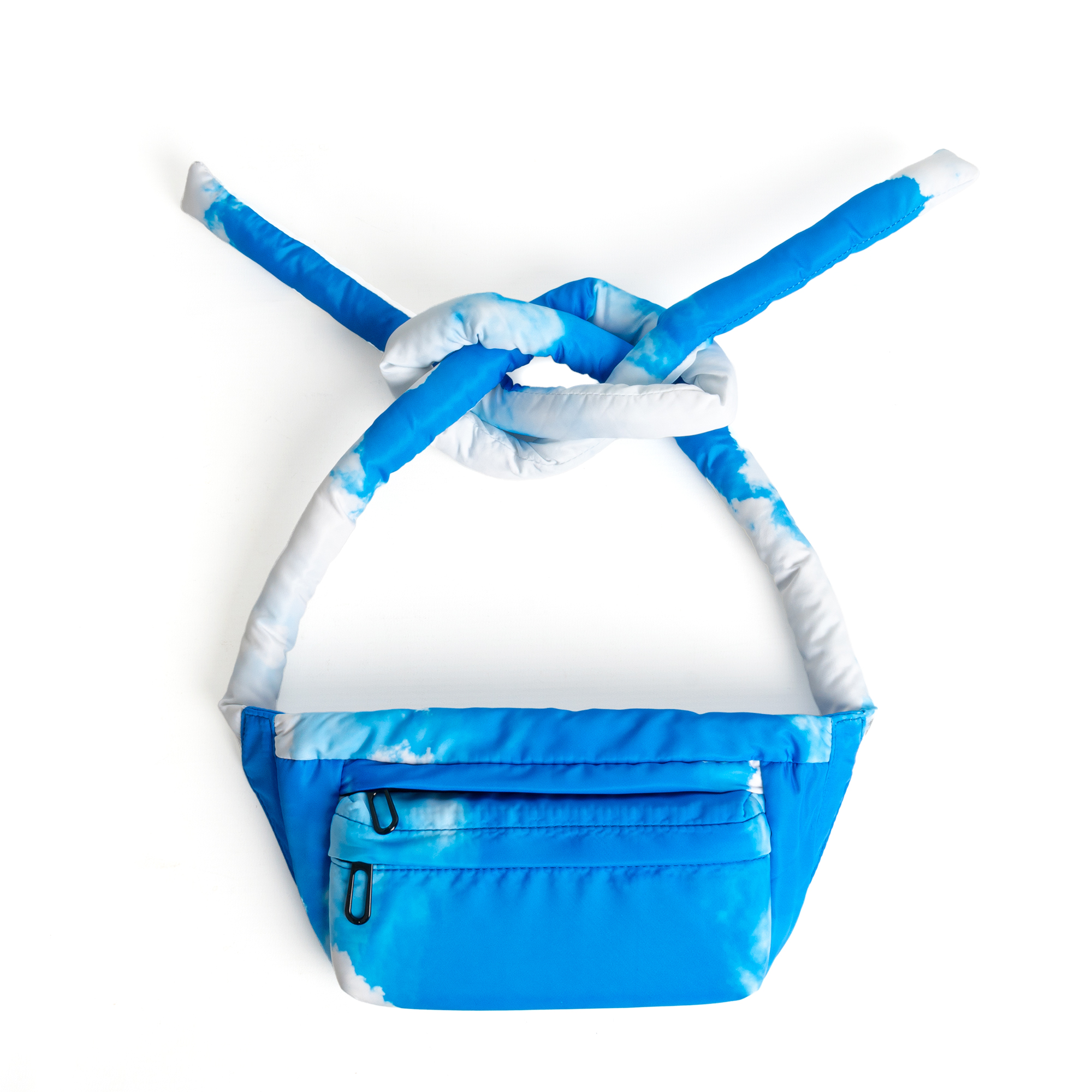 The Knotflex Pack - Sky features a blue and white cloud pattern, displayed against a white background. Its thick strap is tied in an overhand knot, making this stylish accessory ideal for trendsetters and concept shops alike. Gate21.ee
