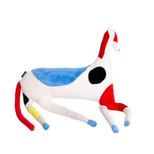 The Abstract Horse - Large Cushion features a white body with blue and red patches, a black circle on its side, and yellow, blue, and red legs. Shown against a plain white background. Gate21.ee