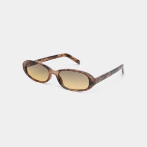 MACY - Coquina: Oval sunglasses with brown tortoiseshell frames and graduated brown lenses, shown angled on white. Inspired by Estonian design, this curated accessory is perfect for those with a distinctive sense of style. Gate21.ee