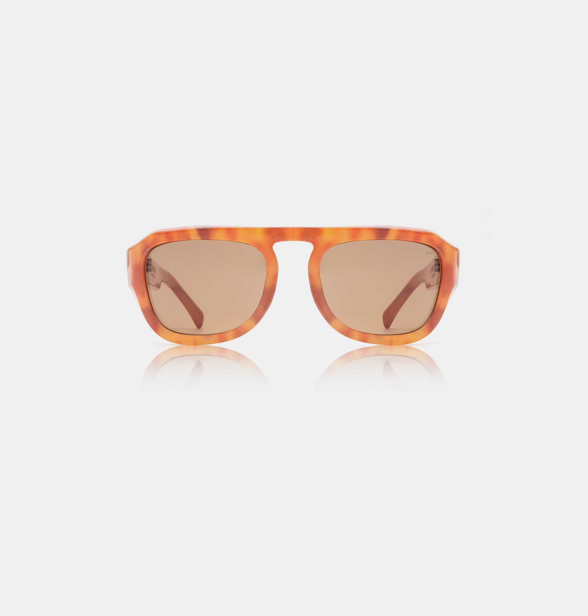 The MAX - Burnt Amber sunglasses feature rectangular brown-tinted lenses and an orange tortoiseshell frame inspired by Estonian design, shown against a plain white background. Gate21.ee