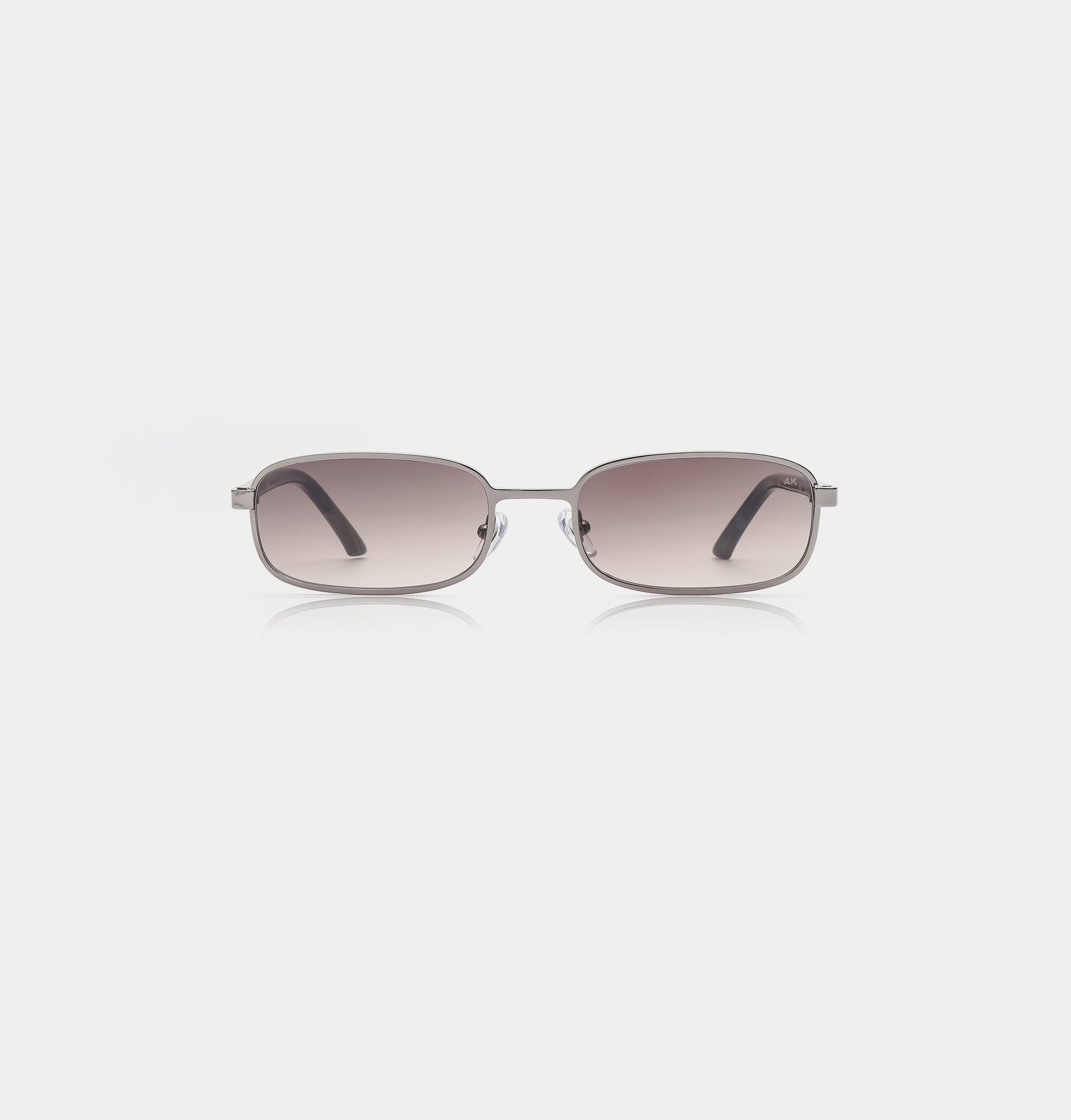 The NOAH - Silver Striped Horn features rectangular sunglasses with thin metal frames and dark gradient lenses, inspired by Estonian design, displayed facing forwards on a plain white background. Gate21.ee