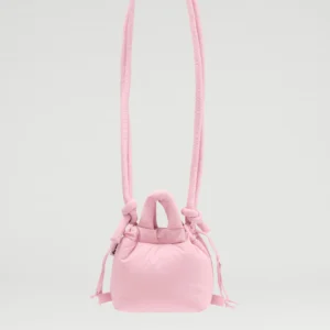 The Micro Ona Soft Bag in pale pink features a padded texture, two short handles, and a thick padded shoulder strap—ideal for Tallinn shopping—displayed against a plain light grey background. Gate21.ee