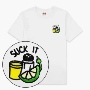 The Suck it Tequila T-Shirt - White features a small yellow shot glass, salt shaker, and lime embroidery with "SUCK IT" above—an eye-catching Estonian design ideal for gift shops. Close-up of the embroidery included. Gate21.ee