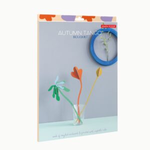 The package shows three vibrant paper flowers in a clear glass with a blue circle and white flower on a light blue background. "Bouquet Autumn Tango"—ideal for Tallinn shoppers and fans of Estonian design—is displayed on the text. Gate21.ee