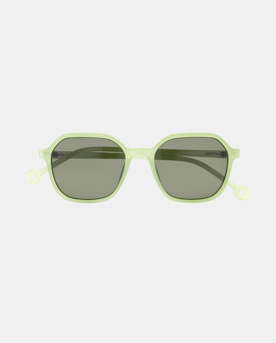 The "Valle" Light Lime Sunglasses feature translucent light green frames with small circular accents on the edges and dark rectangular lenses, displayed against a plain white background. Gate21.ee