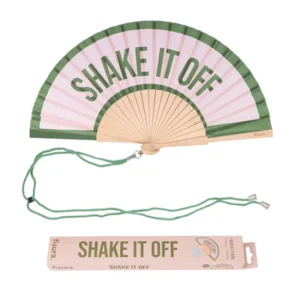 The "Shake it off!" - fan is a handheld folding fan in green and pink, featuring the phrase SHAKE IT OFF. It includes a green strap and matching rectangular box with the same text—an ideal Estonian-designed gift shop item. Gate21.ee