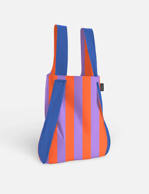 The Royal Stripes - Special Edition tote features vertical purple and orange stripes, blue handles, and trim—a standout Estonian design. Shown on a white background, it’s perfect for curated gift shops. Gate21.ee