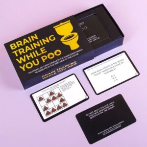 An open box of Brain Training while you Poo - Cards displays trivia and puzzle cards, including Food and Drink Trivia Card Game cards with cartoon poo icons arranged in rows. Gate21.ee