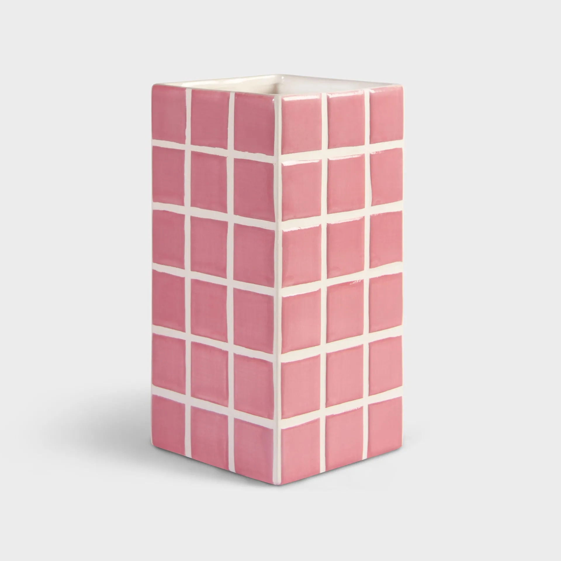 The Vase Tile - Pink (10.5 x 10.5 x 21 cm) features a refined Estonian design with a pink and white grid pattern, glossy finish, and sharp corners—ideal for stylish Tallinn finds or gift shop displays on a light grey background. Gate21.ee