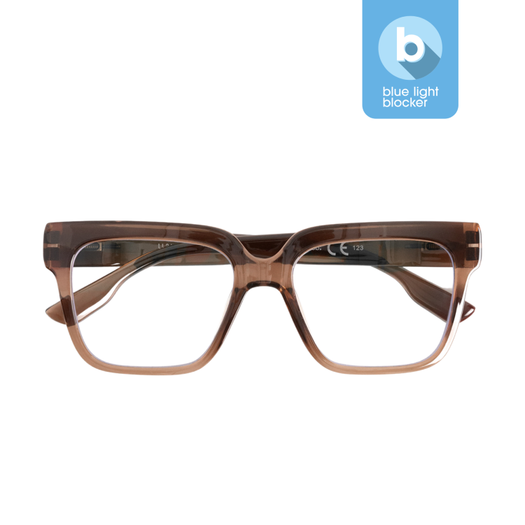 The MAX - Blue Light - Hazel 0.0 are rectangular, transparent brown spectacles with thick frames, shown front-facing. A blue icon in the corner highlights their blue light blocker feature—an ideal curated gift shop pick. Gate21.ee