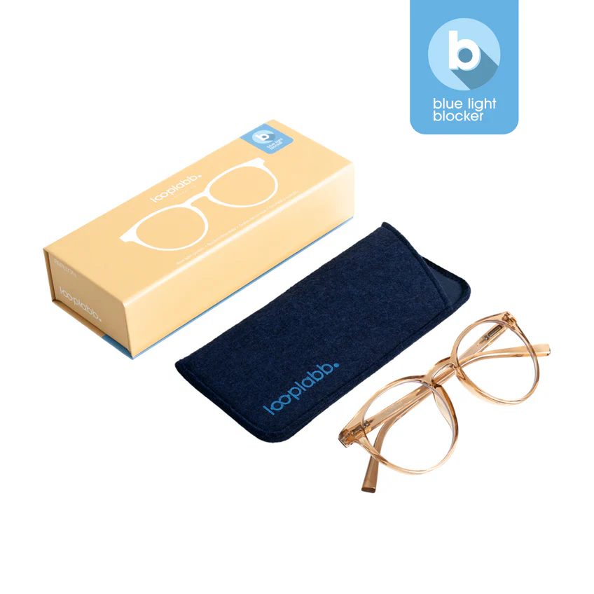The PAPILLON - Blue Light - Crystal Champagne 0.0 spectacles come with a navy blue soft case and a beige illustrated box—ideal for gift shops or concept stores. A blue light blocker label featuring a white "b" appears in the top right corner. Gate21.ee