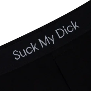 Close-up of the Suck It Boxers - Black, showcasing "Suck My Dick" in white letters—a bold piece of Estonian design you might spot whilst shopping in Tallinn. Gate21.ee