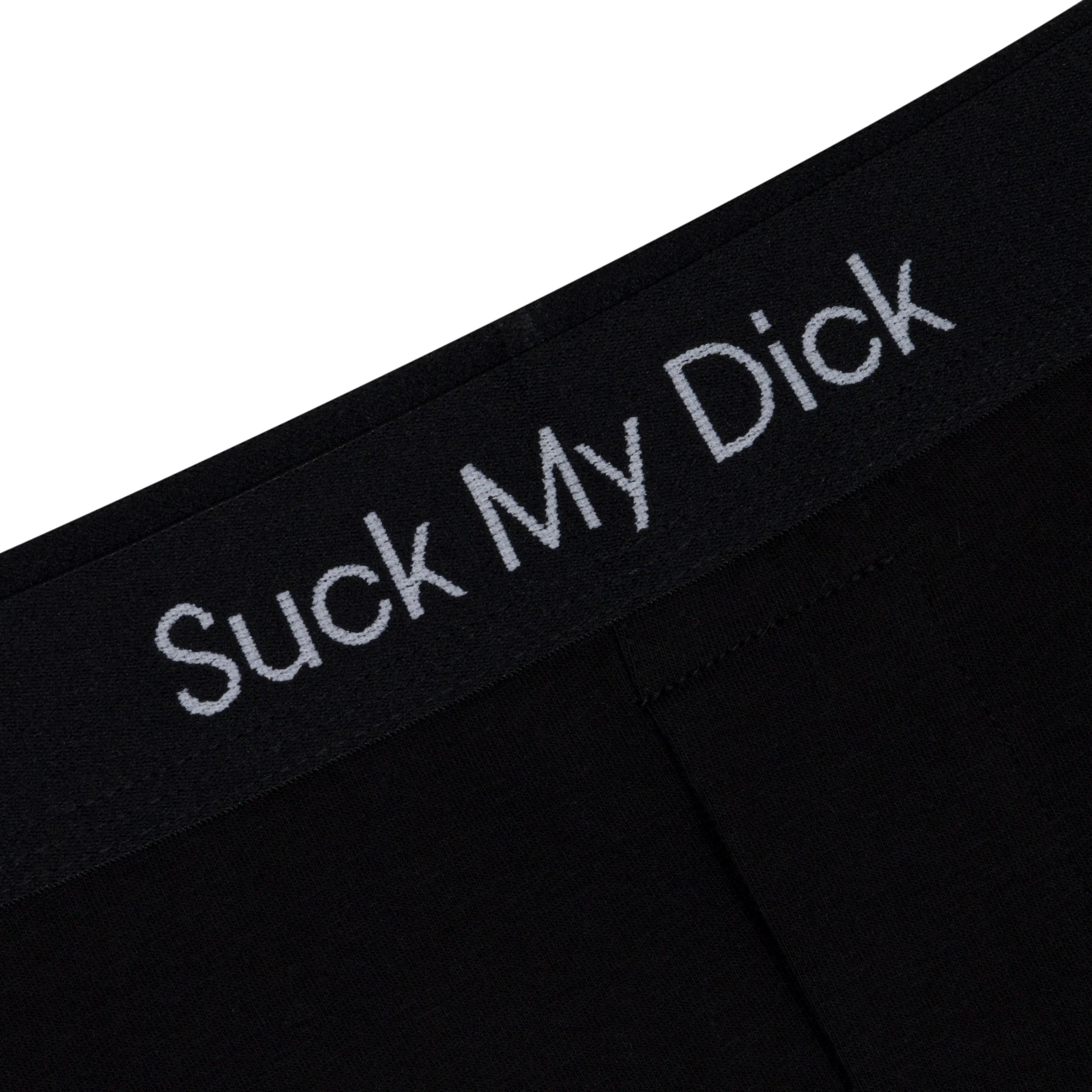Close-up of the Suck It Boxers - Black, showcasing "Suck My Dick" in white letters—a bold piece of Estonian design you might spot whilst shopping in Tallinn. Gate21.ee
