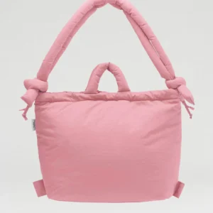 The Ona Soft Bag - Pale Pink is a padded tote with two short handles and two knotted shoulder straps, exemplifying unique Estonian design, displayed against a plain white background. Gate21.ee