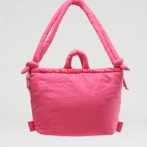 The Ona Soft Bag - Pink is a bright pink padded tote with two thick shoulder straps and knot details, showcasing Estonian design against a plain light grey background. Gate21.ee