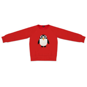 The Kids Penguin is a red long-sleeve jumper with a black and white big-eyed penguin, sleeves extended flat. Showcasing playful Estonian design, it’s an ideal choice to add charm to your wardrobe or gift shop selection. Gate21.ee