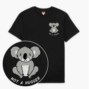 The Not A Hugger T-Shirt - Black features a cartoon koala with a neutral expression and “NOT A HUGGER” in white capitals—ideal for fans of curated Estonian design. A close-up shows the detailed, charming graphic. Gate21.ee
