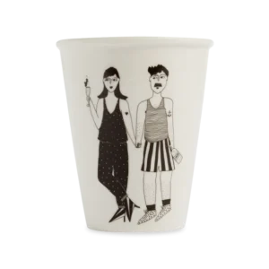The Apero couple cup is a white mug with a black line drawing of two people holding hands—one with a drink, both in patterned outfits and short hair. This charming Estonian design makes a perfect Tallinn souvenir or gift shop find. Gate21.ee